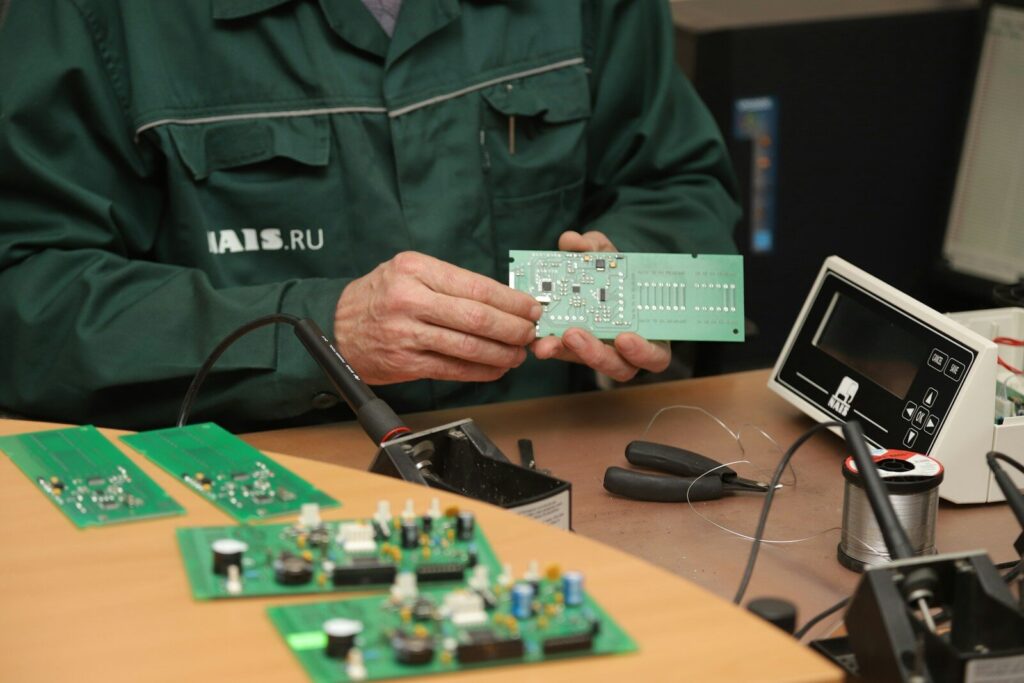 a man holding a piece of electronic equipment